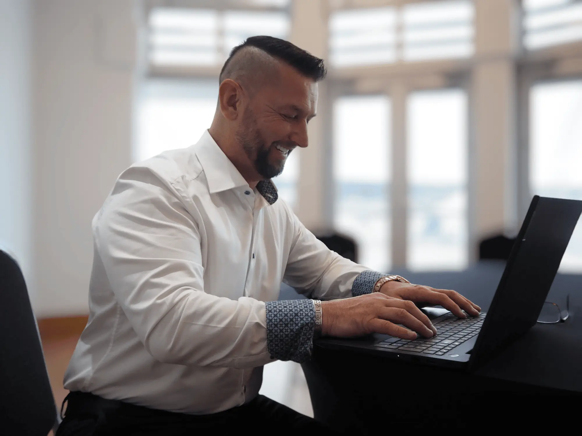 Steve working on his laptop