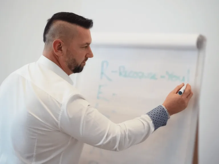 Steve writing on a flip chart